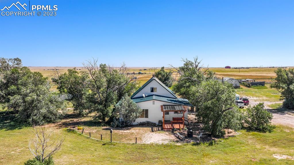 2905 Lauppe Road Yoder, CO 80864 - Photo 7 of 34 a house with swimming pool in front of it