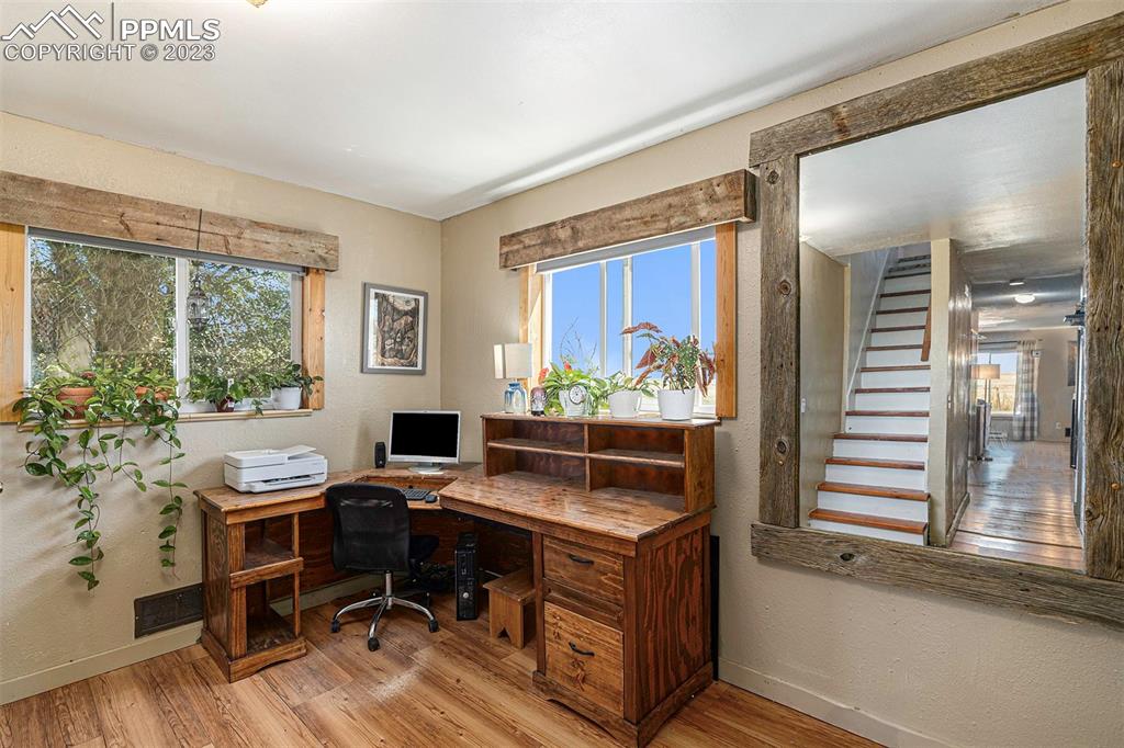 2905 Lauppe Road Yoder, CO 80864 - Photo 10 of 34 a view of a workspace with furniture and a window
