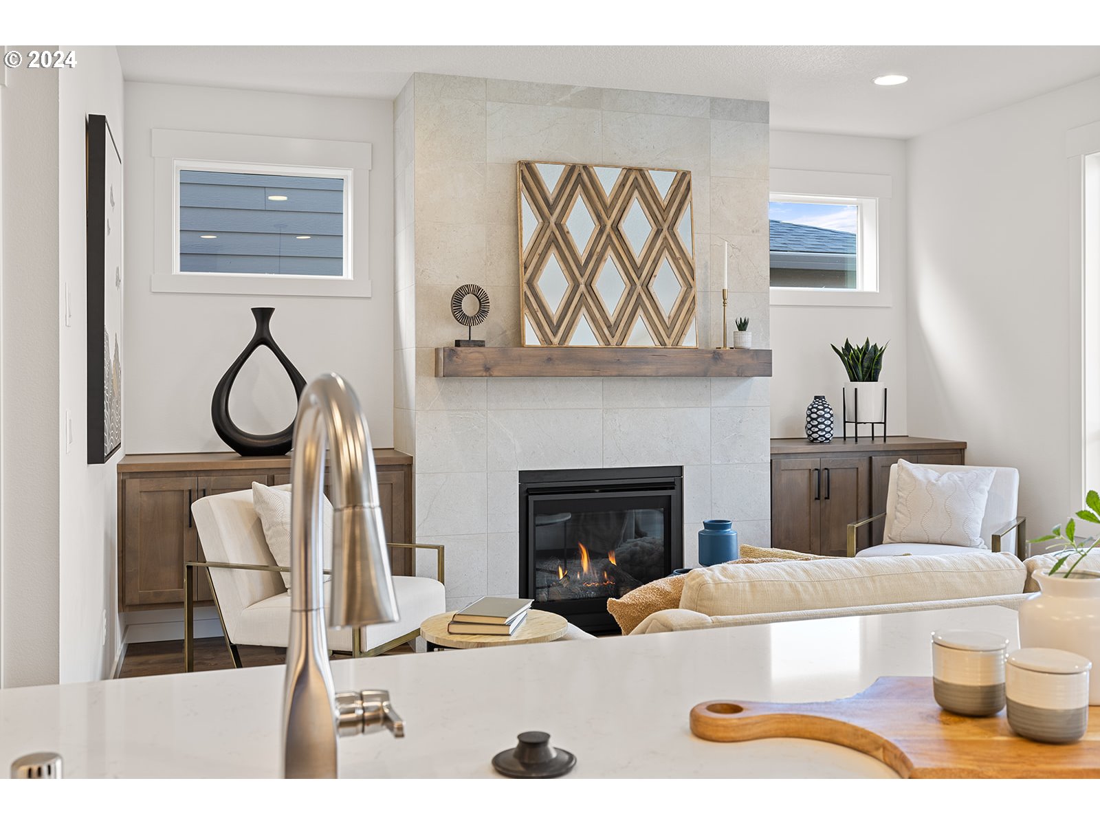 918 Northwest 178th Street Ridgefield, WA 98642 - Photo 24 of 47 a living room with furniture a fireplace and wall paintings