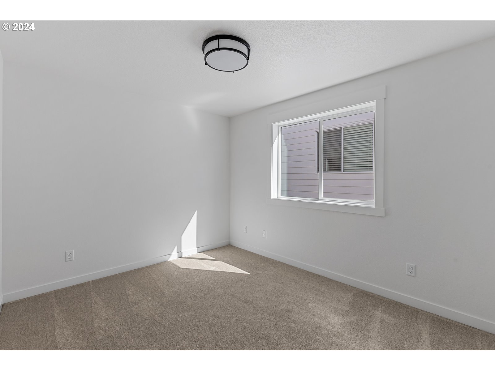 918 Northwest 178th Street Ridgefield, WA 98642 - Photo 44 of 47 a view of an empty room with a window