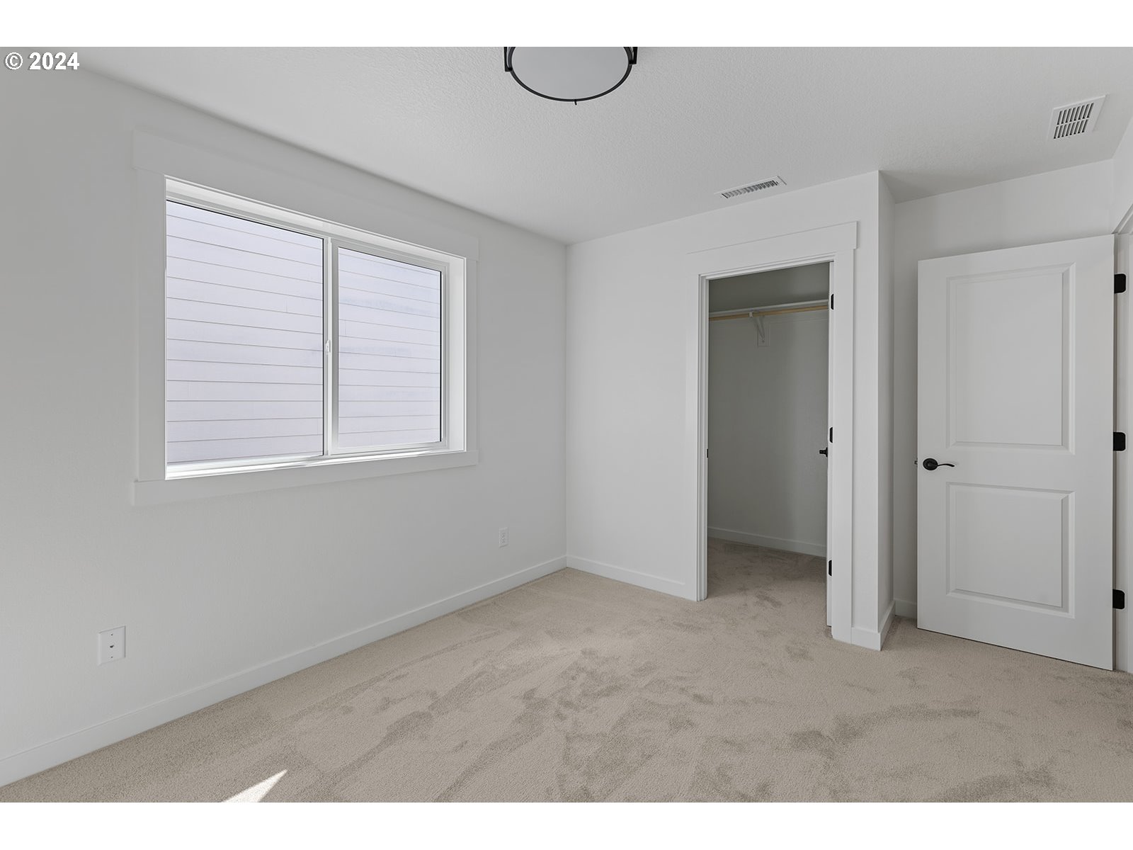 918 Northwest 178th Street Ridgefield, WA 98642 - Photo 45 of 47 a view of an empty room with a window