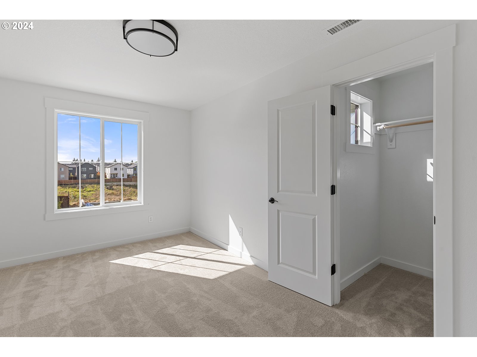 918 Northwest 178th Street Ridgefield, WA 98642 - Photo 47 of 47 a view of an empty room with window and closet area