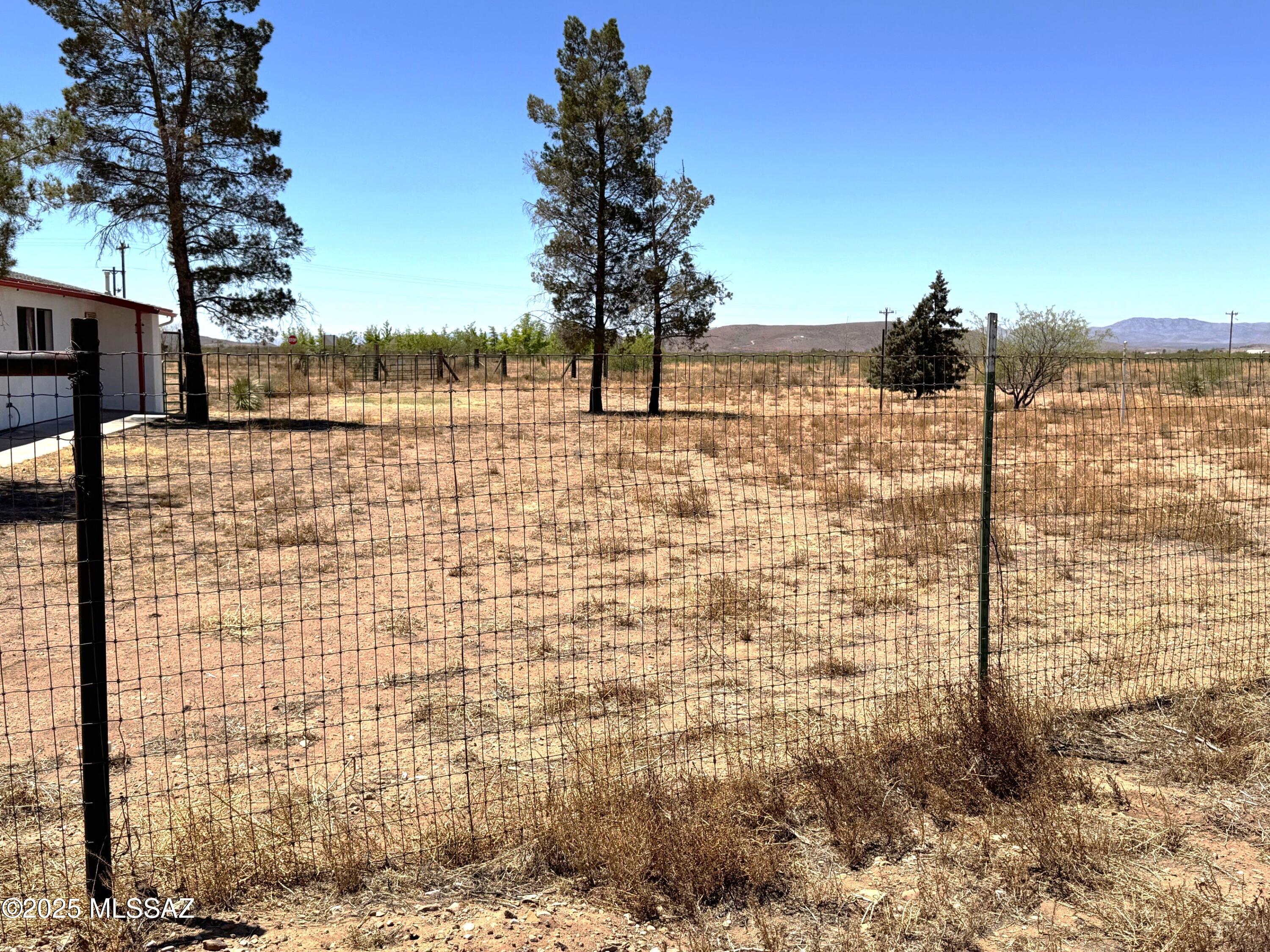 13384 South Cottonwood Road Pearce, AZ 85625 - Photo 8 of 46 a view of a lake with a building in the background