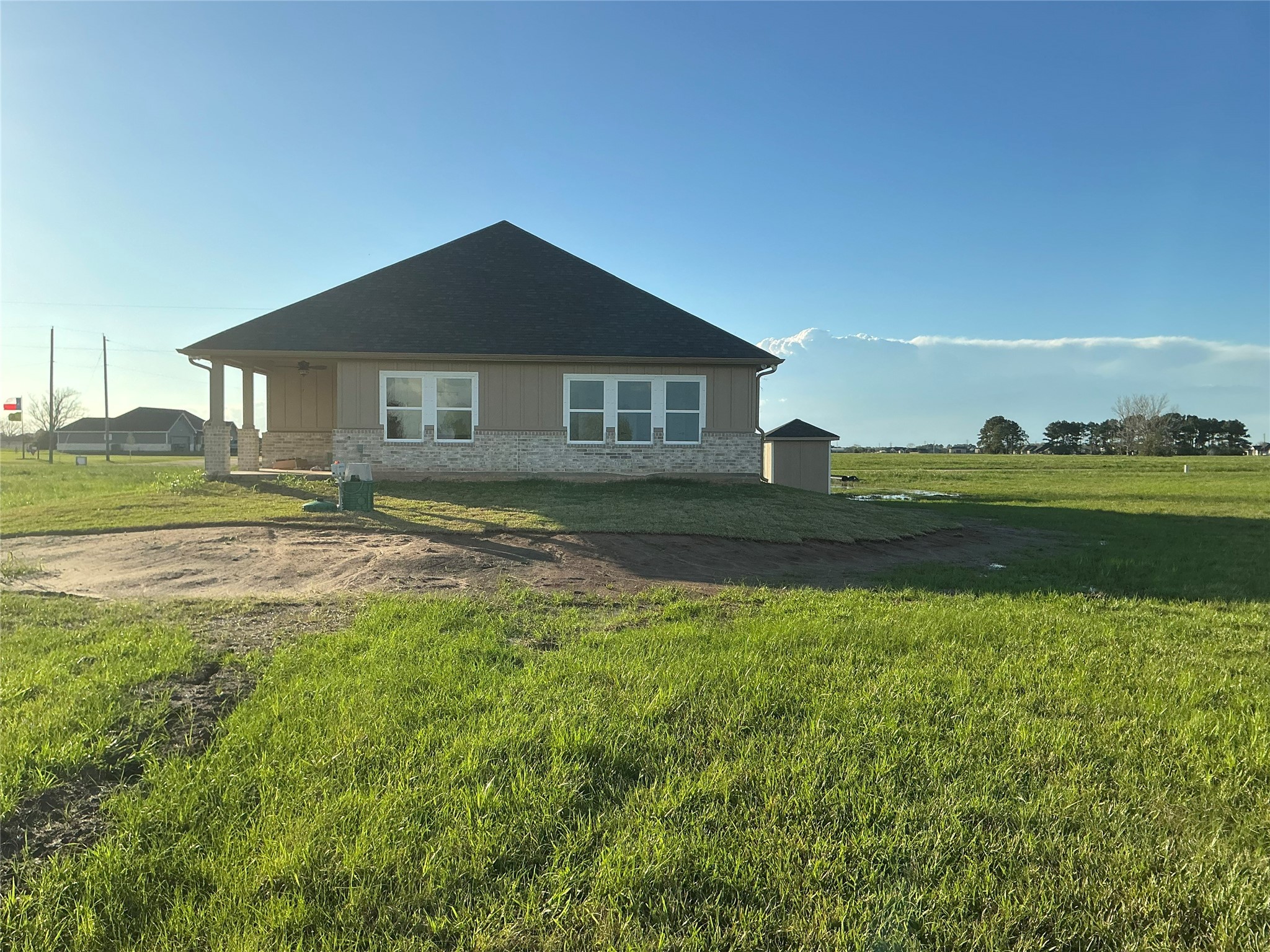 471 Buffalo Trail Angleton, TX 77515 - Photo 32 of 35 Charming single-story home set on a spacious, green lot. It features a covered porch and a modern exterior with brick accents. Ideal for those seeking peaceful, open surroundings.
