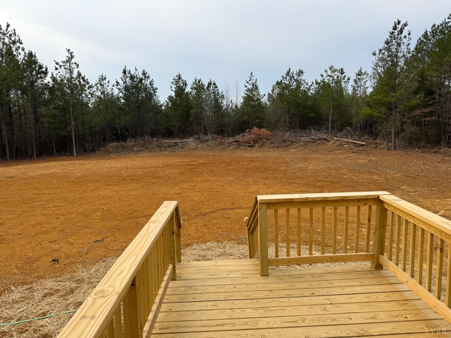 4103 Hog Wallow Road Nathalie, VA 24577 - Photo 20 of 20 a view of deck and lake with trees in the background