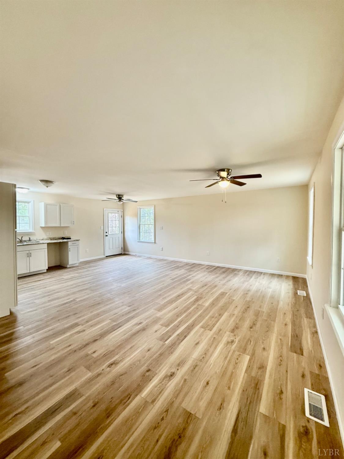4103 Hog Wallow Road Nathalie, VA 24577 - Photo 2 of 20 a view of empty room with wooden floor