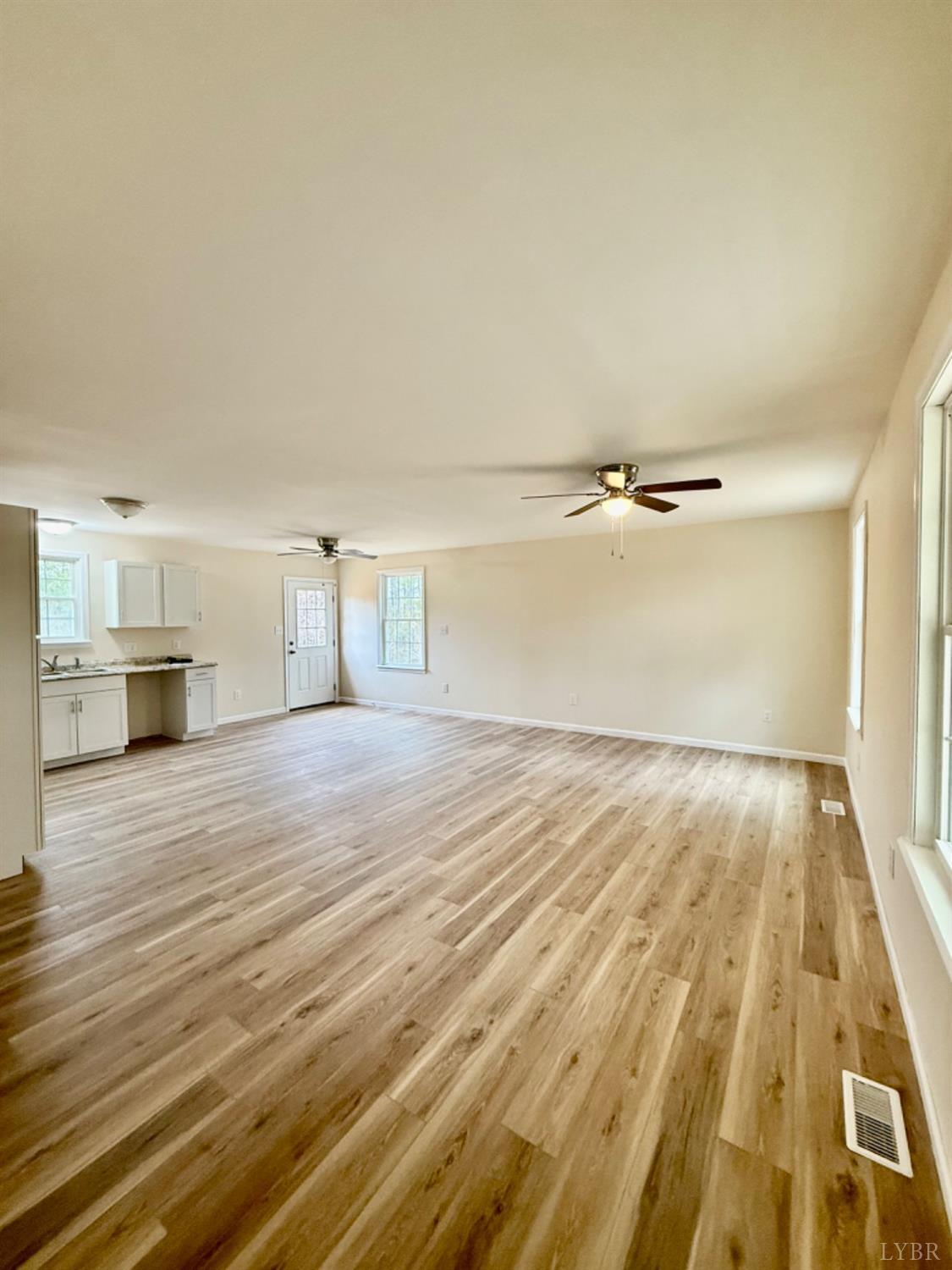 4103 Hog Wallow Road Nathalie, VA 24577 - Photo 4 of 20 a view of empty room with wooden floor