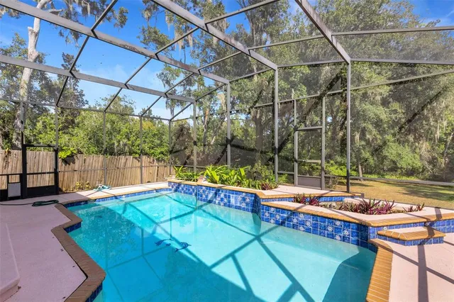 a view of a patio with a table and chairs