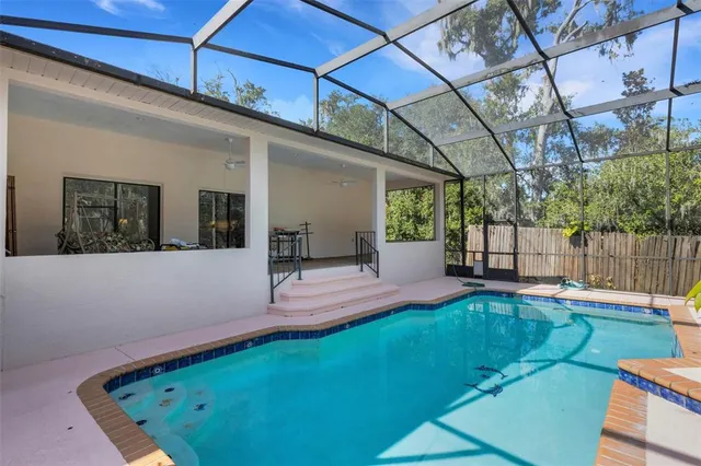 a view of a backyard with sitting area