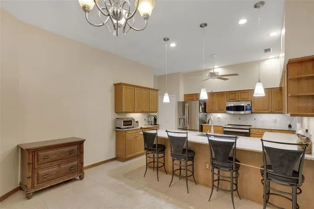 a kitchen with lots of counter top space and appliances