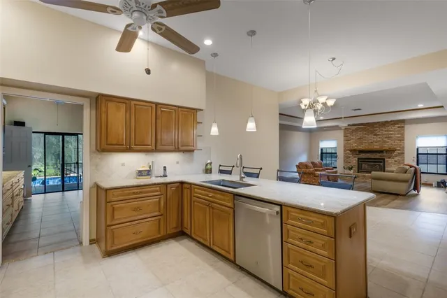 a kitchen with sink and cabinets