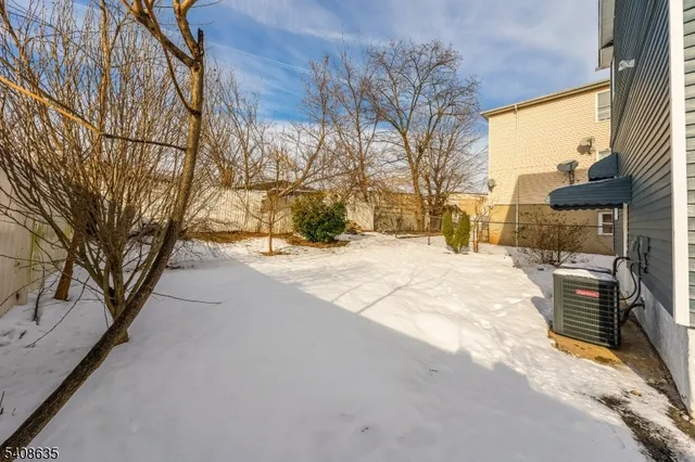 a street view with large trees