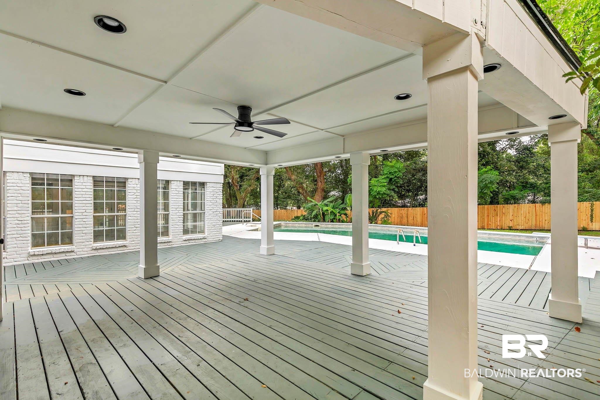 4705 Sherry Court Mobile, AL 36693 - Photo 70 of 100 Wooden deck with a ceiling fan