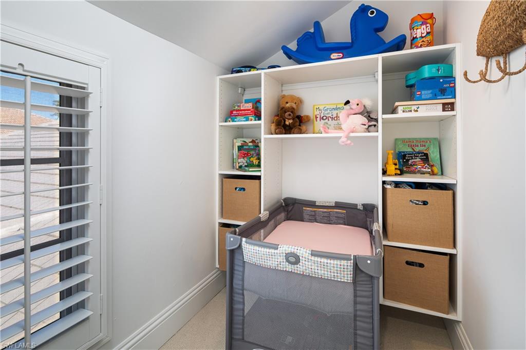 485 Wedge Drive Naples, FL 34103 - Photo 17 of 25 a room with storage and utility