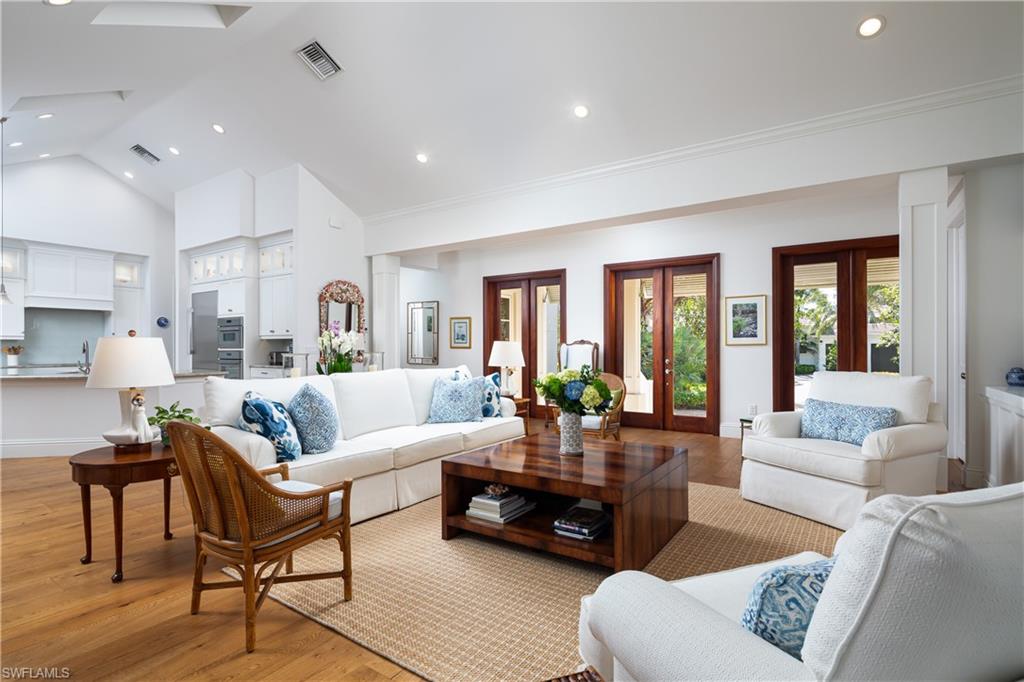 485 Wedge Drive Naples, FL 34103 - Photo 3 of 25 a living room with furniture and a large window