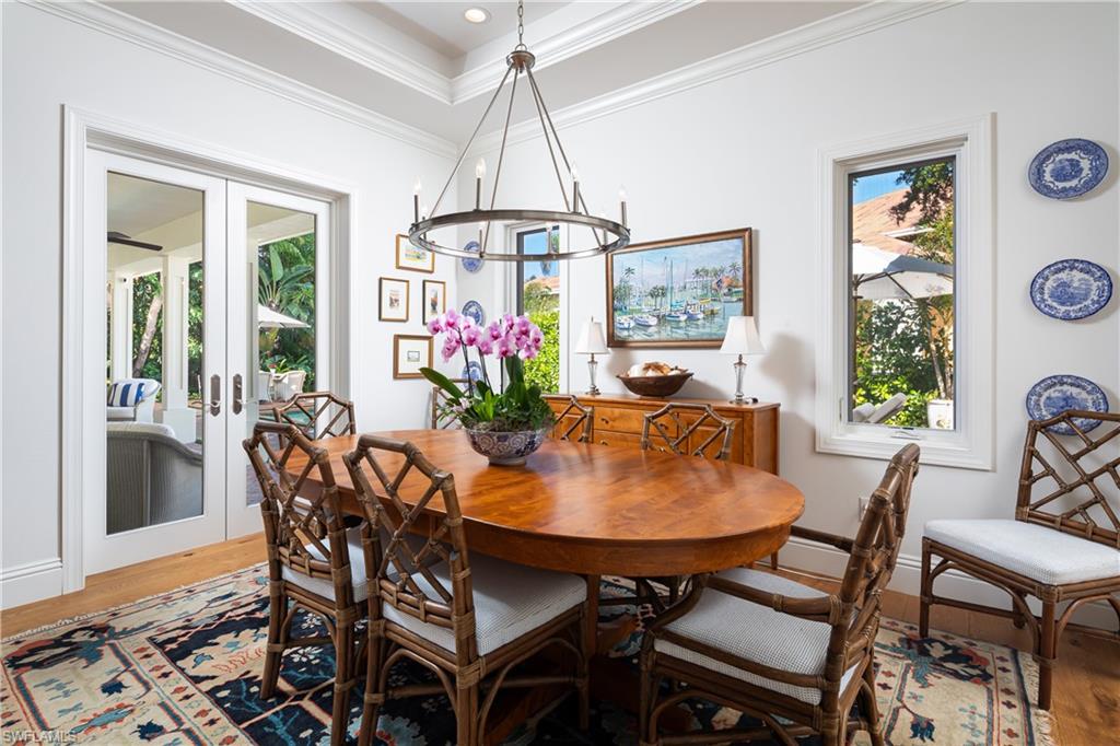485 Wedge Drive Naples, FL 34103 - Photo 8 of 25 a dining room with furniture and window