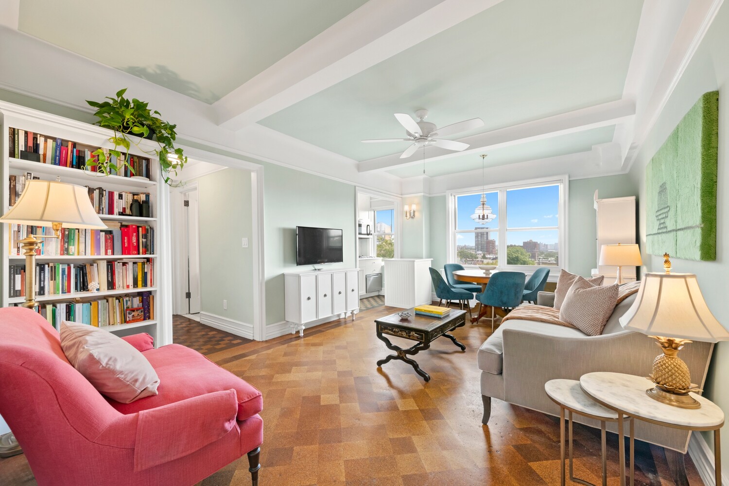 a living room with furniture cabinets and a book shelf