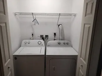 a bathroom with a sink vanity granite tub shower and a mirror
