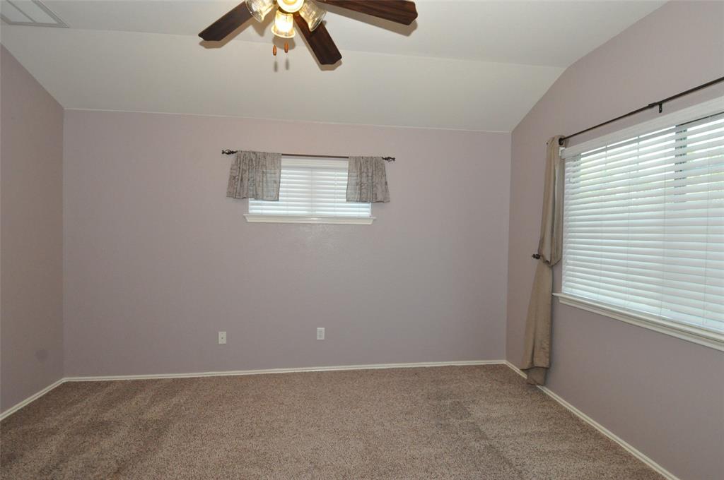 1900 Scofield Ridge Parkway, Unit 5403 Austin, TX 78727 - Photo 17 of 30 an empty room with ceiling fan and window