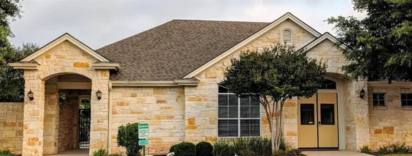 a view of front of house with a small yard