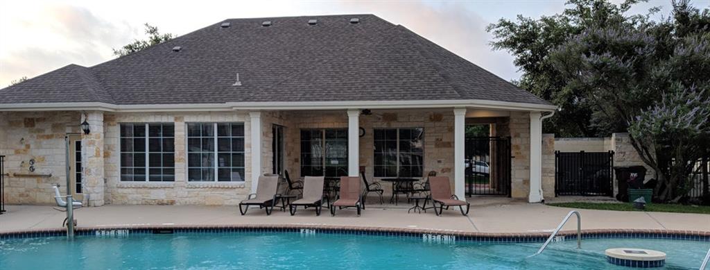 1900 Scofield Ridge Parkway, Unit 5403 Austin, TX 78727 - Photo 29 of 30 a front view of a house with a yard fire pit and outdoor seating