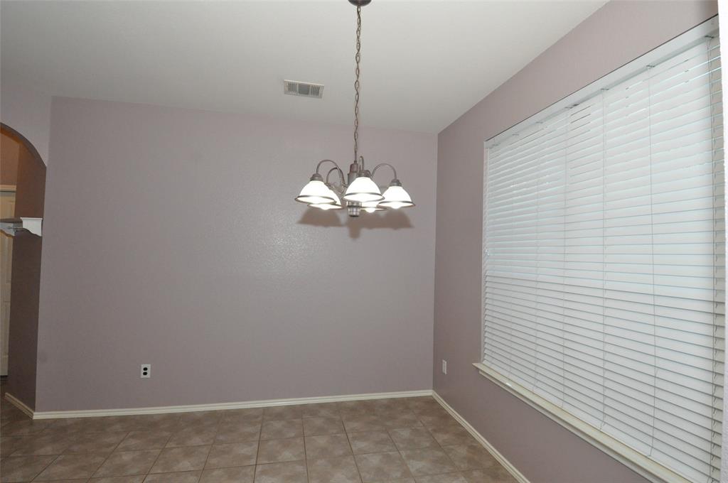 1900 Scofield Ridge Parkway, Unit 5403 Austin, TX 78727 - Photo 7 of 30 a room with a chandelier fan and a window