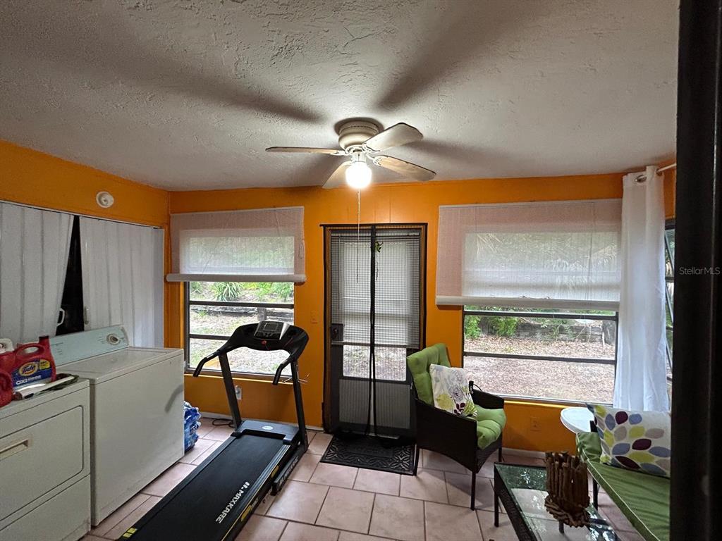Undisclosed Address New Port Richey, FL 34652 - Photo 9 of 25 a bedroom with furniture and a window