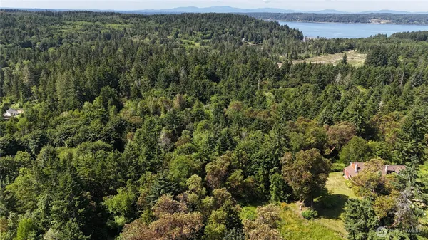 an aerial view of a houses with a yard