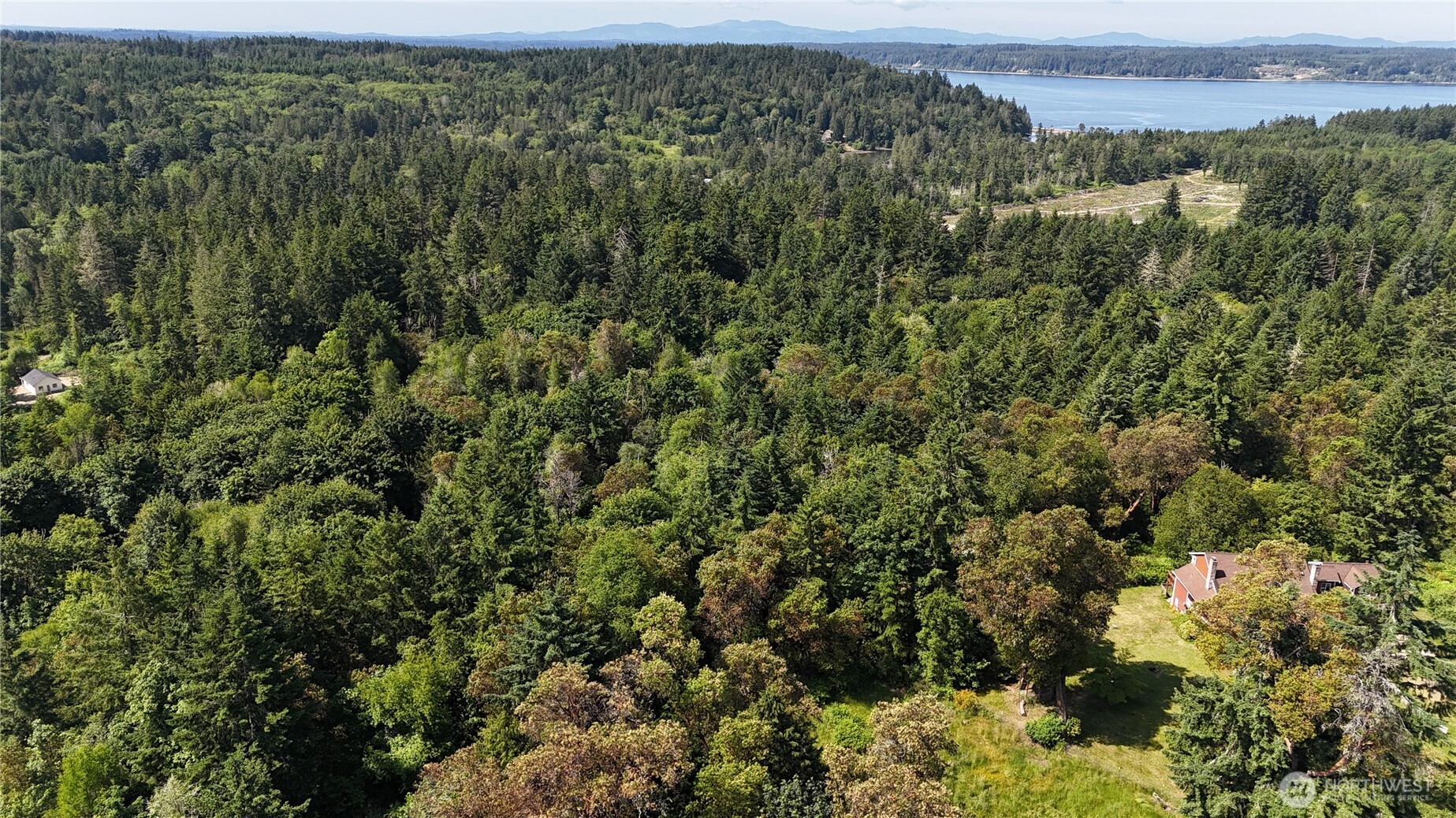 an aerial view of a houses with a yard