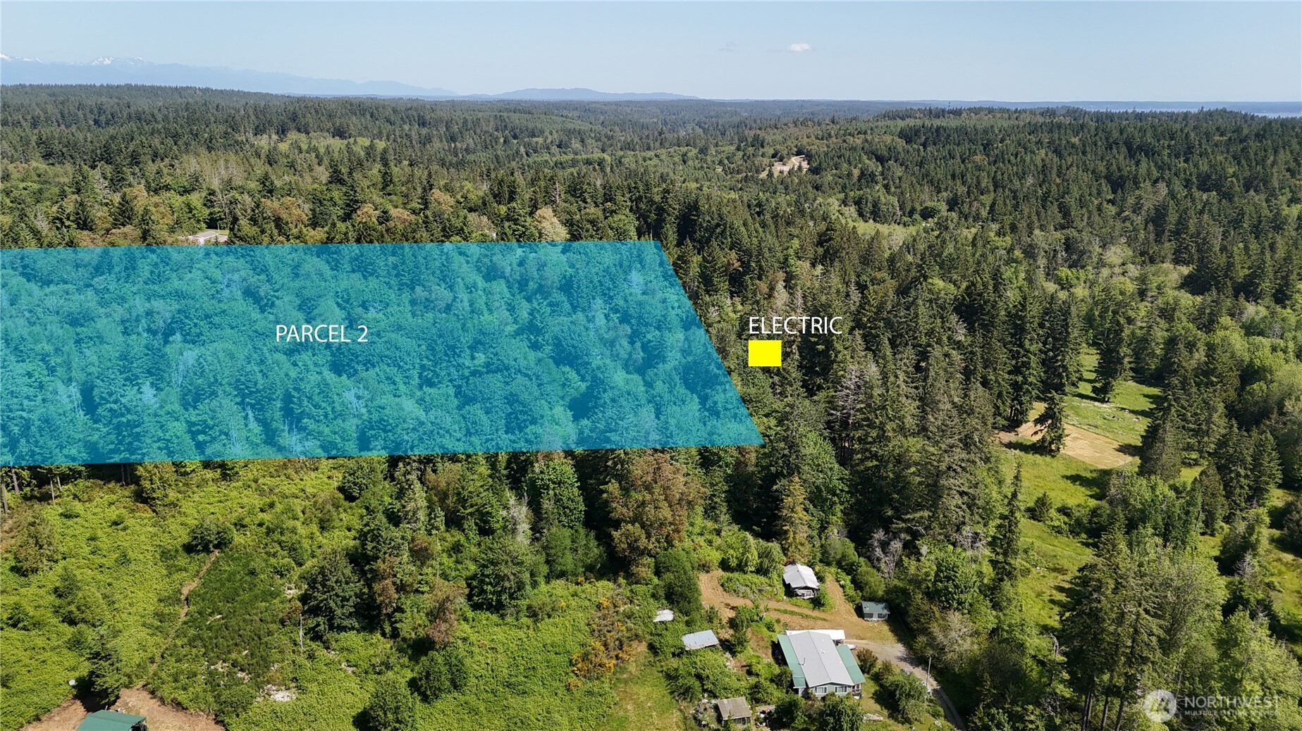 18771 Erickson Road Southwest Longbranch, WA 98349 - Photo 3 of 9 an aerial view of residential houses with outdoor space and trees