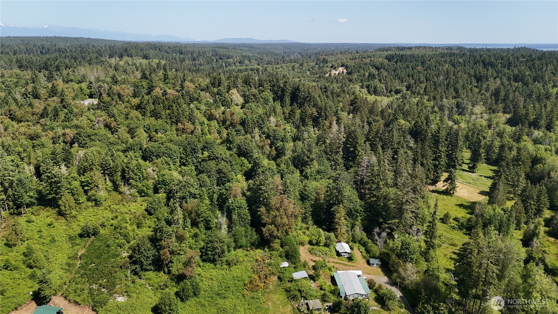 18771 Erickson Road Southwest Longbranch, WA 98349 - Photo 4 of 9 an aerial view of multiple house
