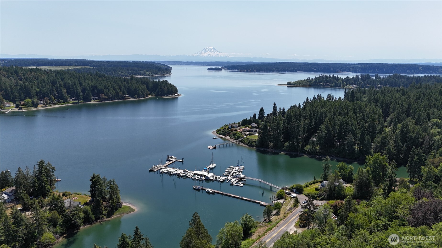 18771 Erickson Road Southwest Longbranch, WA 98349 - Photo 5 of 9 an aerial view of a house with a lake view