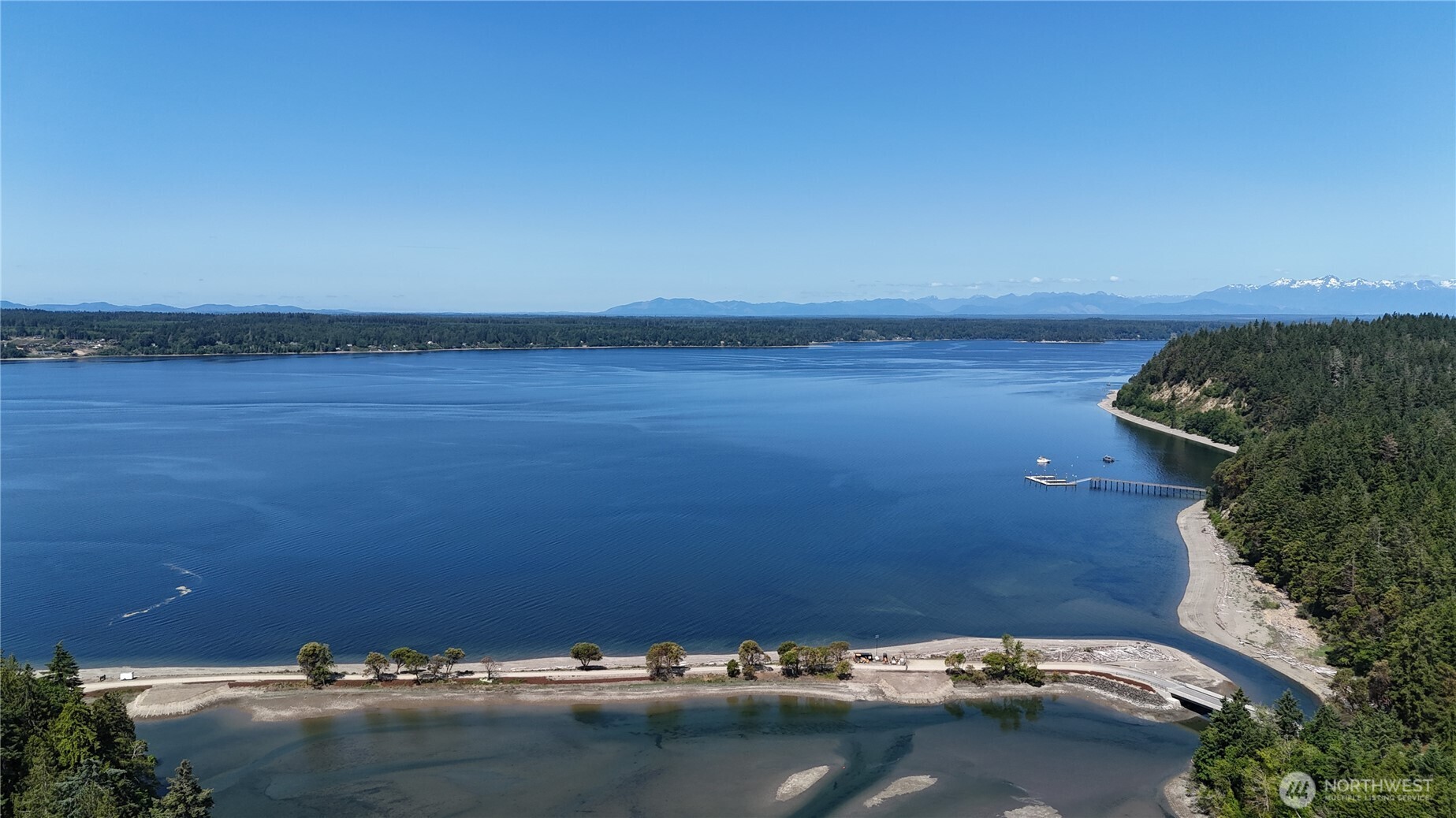 18771 Erickson Road Southwest Longbranch, WA 98349 - Photo 8 of 9 an aerial view of a houses with a lake view