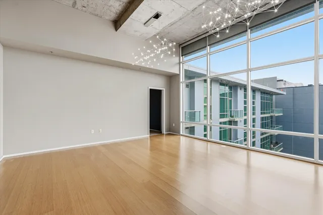 a view of an empty room with a ceiling fan