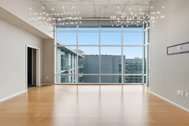 a kitchen with kitchen island a counter top space a sink stainless steel appliances and cabinets