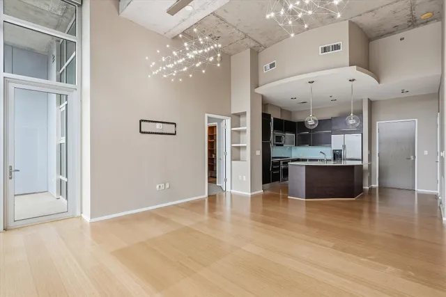 a view of a room with a ceiling fan