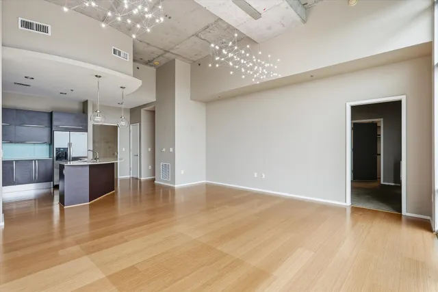 a view of walk in closet with empty racks