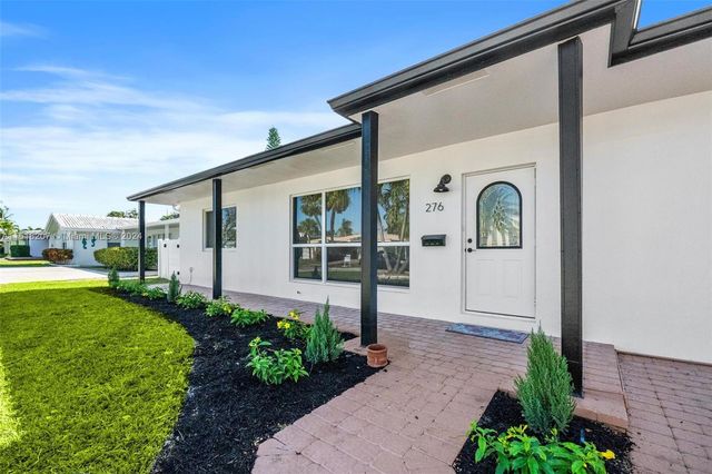 a view of a back yard of the house