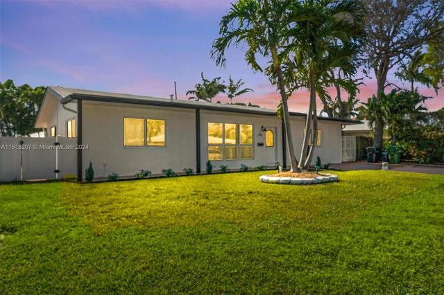 a view of a house with swimming pool and a yard