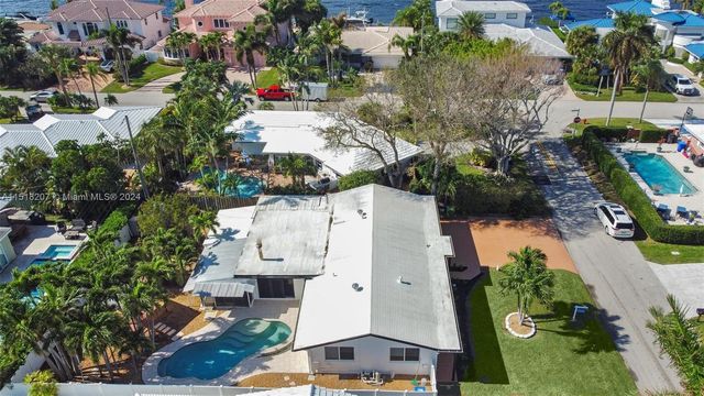 a view of house with a swimming pool
