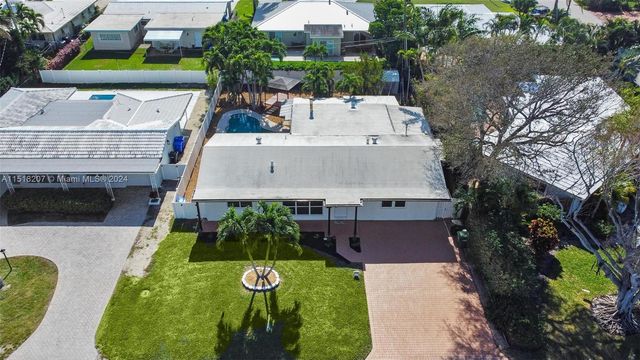 a swimming pool with outdoor seating and yard