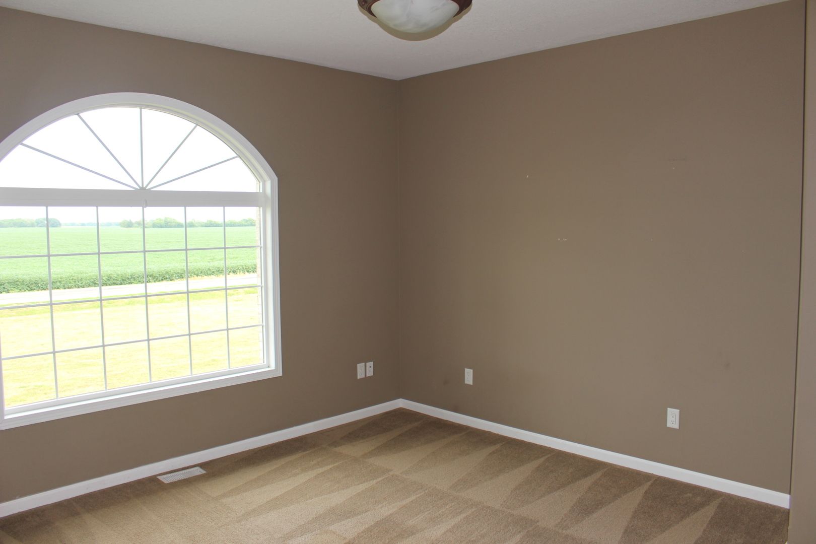 3978 Connors Road Clinton, IL 61727 - Photo 13 of 34 an empty room with a window