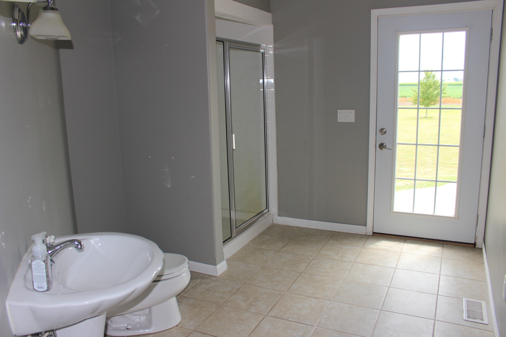 3978 Connors Road Clinton, IL 61727 - Photo 15 of 34 a bathroom with a tub and sink