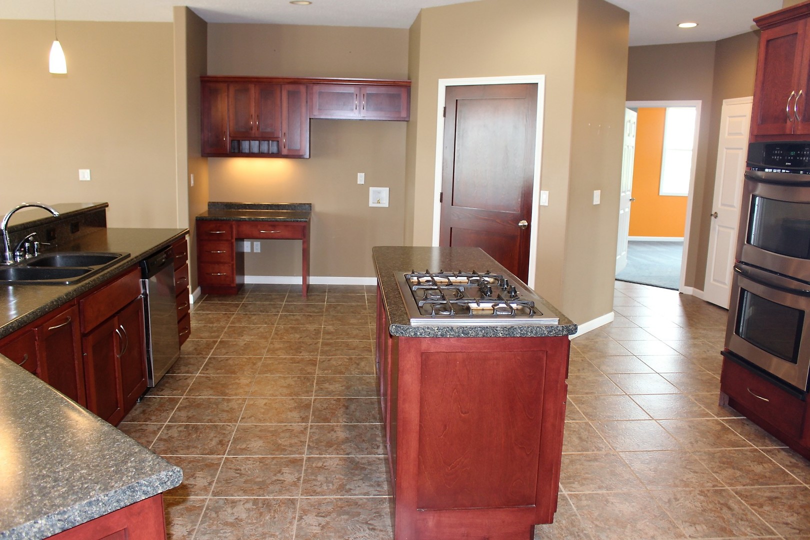 3978 Connors Road Clinton, IL 61727 - Photo 3 of 34 a kitchen with stainless steel appliances granite countertop a stove a sink and a refrigerator