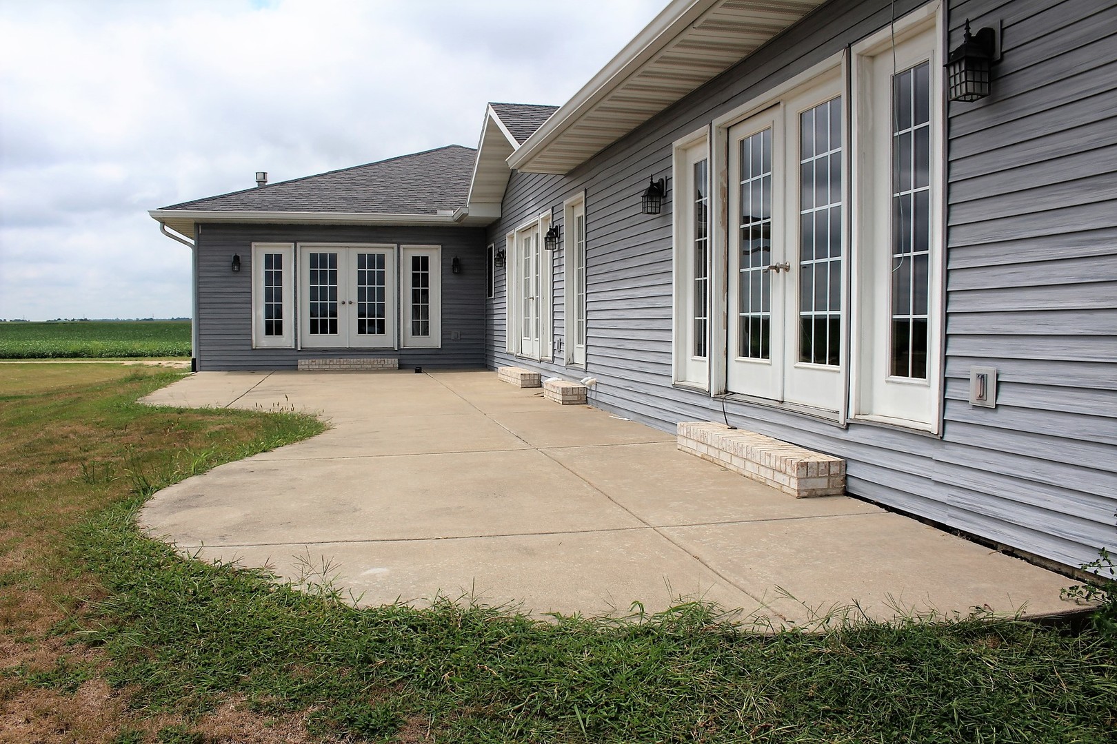 3978 Connors Road Clinton, IL 61727 - Photo 29 of 34 front view of a house with a yard