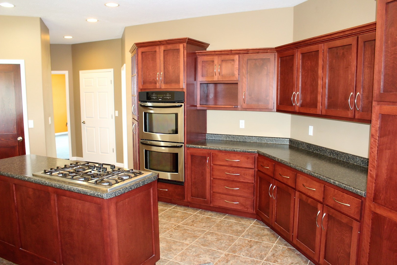 3978 Connors Road Clinton, IL 61727 - Photo 4 of 34 a kitchen with stainless steel appliances granite countertop a stove refrigerator and cabinets