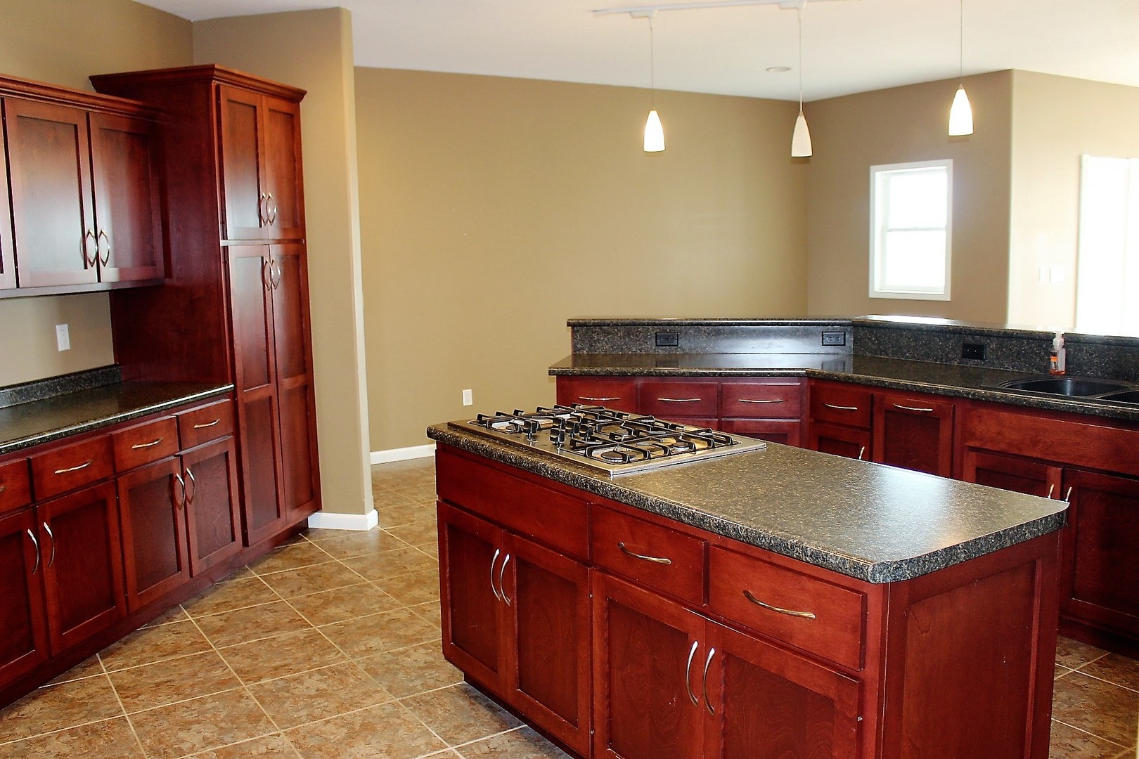 3978 Connors Road Clinton, IL 61727 - Photo 5 of 34 a kitchen with stainless steel appliances granite countertop a sink and wooden cabinets