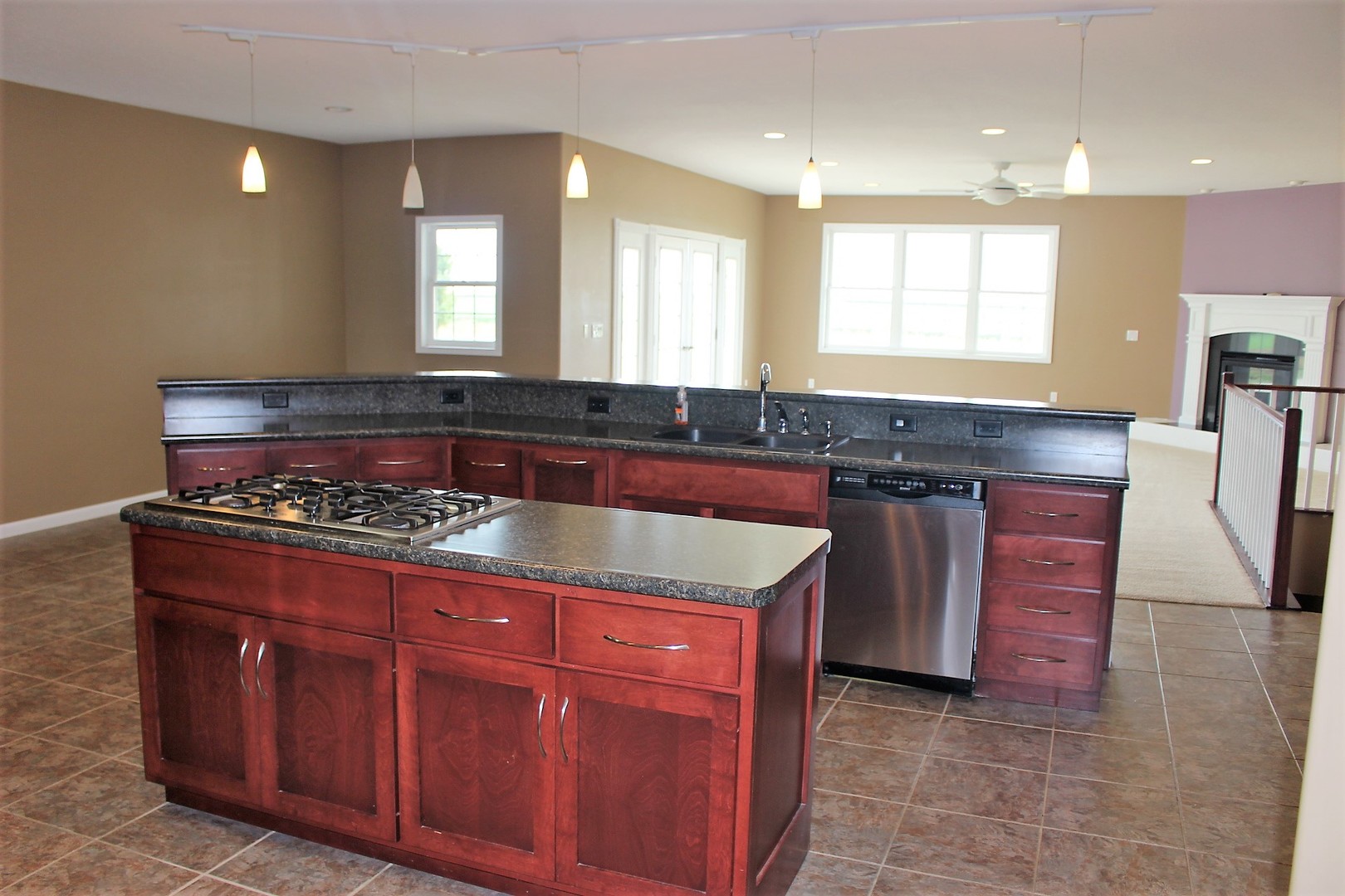 3978 Connors Road Clinton, IL 61727 - Photo 6 of 34 a kitchen with granite countertop a stove a sink and a cabinets
