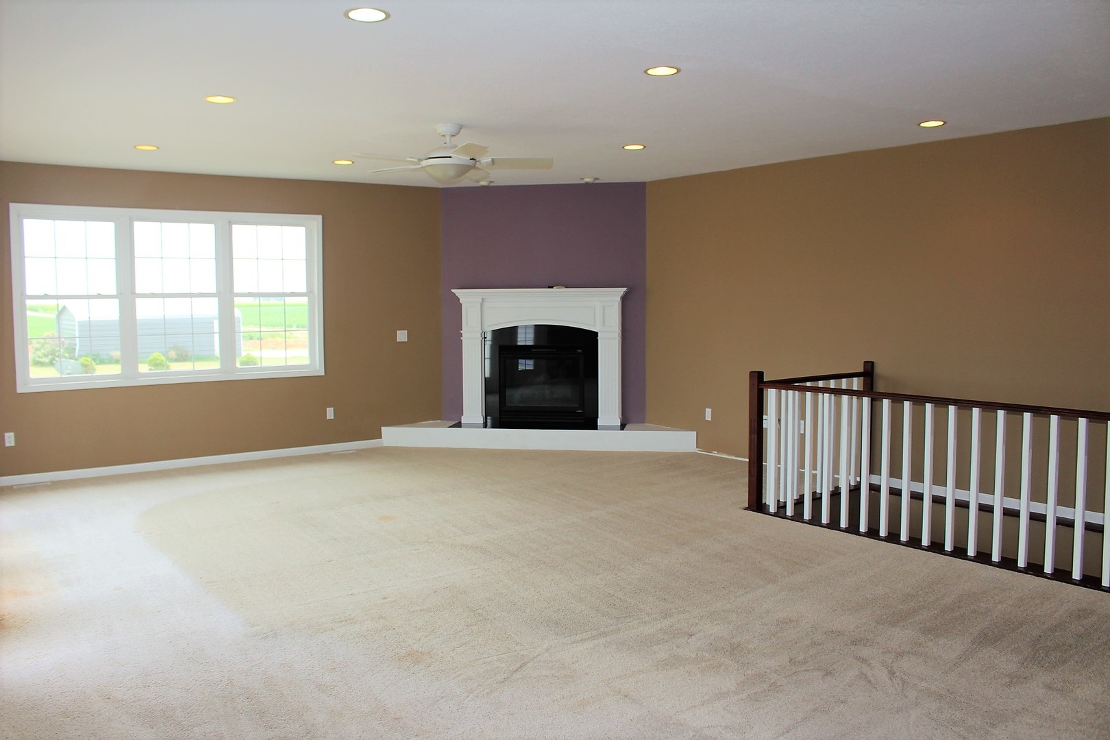 3978 Connors Road Clinton, IL 61727 - Photo 9 of 34 an empty room with windows and fireplace