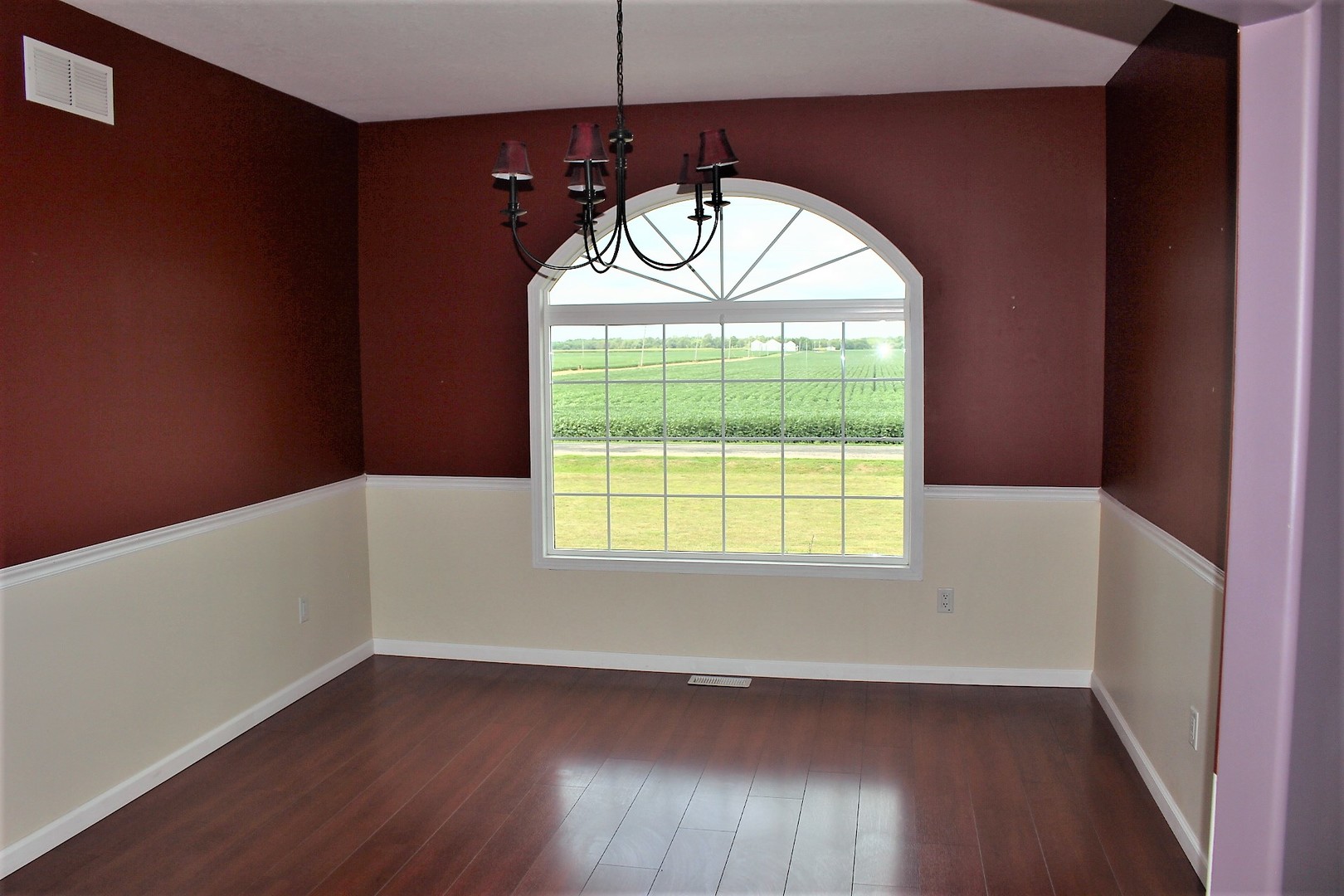 3978 Connors Road Clinton, IL 61727 - Photo 10 of 34 an empty room with wooden floor and windows
